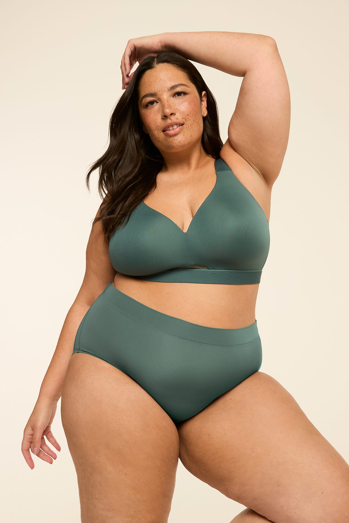 A woman in teal lingerie poses against a plain, light-colored background. Product Image 6