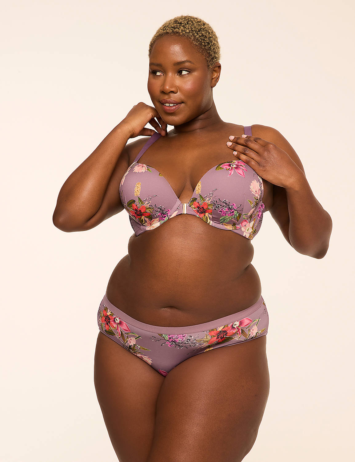 A woman in a floral bra and underwear stands against a plain, light-colored background. Product Image 4