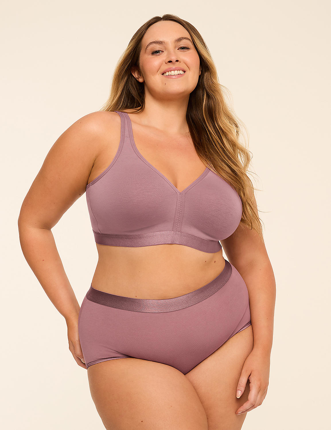 A smiling, plus-size woman in a mauve bra and matching underwear stands against a plain, light-colored background. Product Image 4