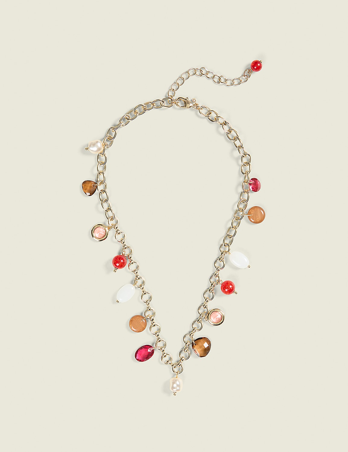A gold chain necklace with colorful beads and charms hangs against a plain, light-colored background. Product Image 1