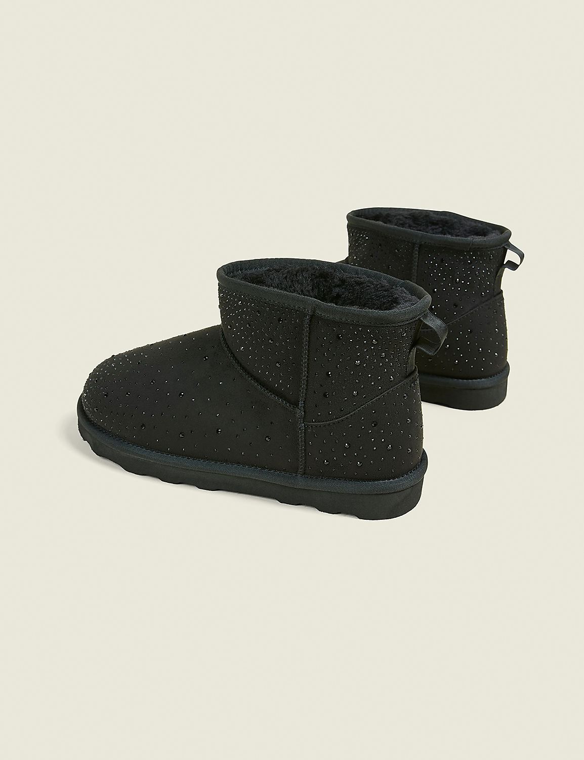 A pair of black, rhinestone-studded ankle boots with fluffy lining are displayed against a plain, light gray background. Product Image 2
