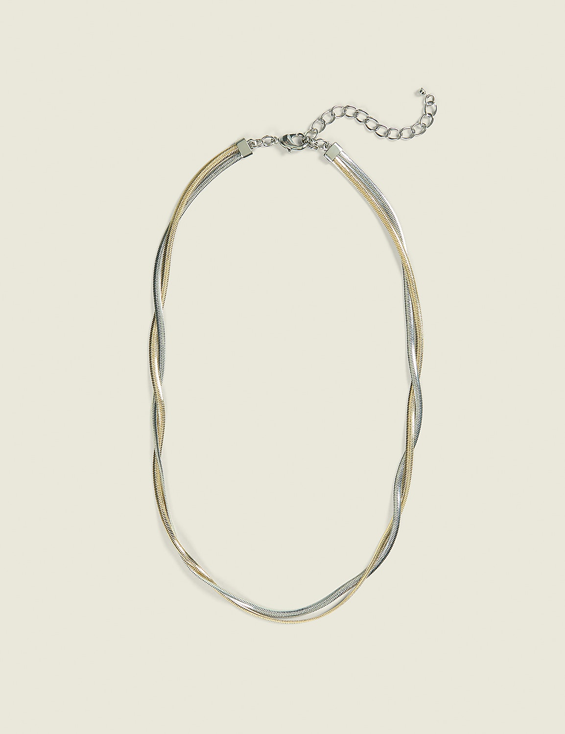 A delicate, multi-strand necklace with silver and gold chains lies on a plain, light beige background. Product Image 1