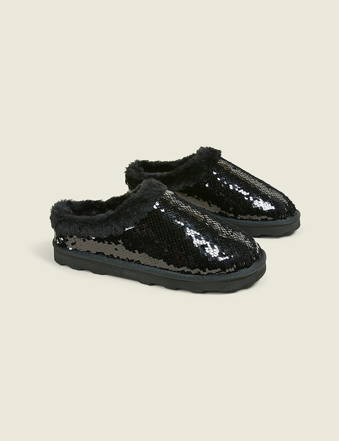 A pair of black sequined slippers with fluffy trim rests on a plain, light-colored background. Product Image 1