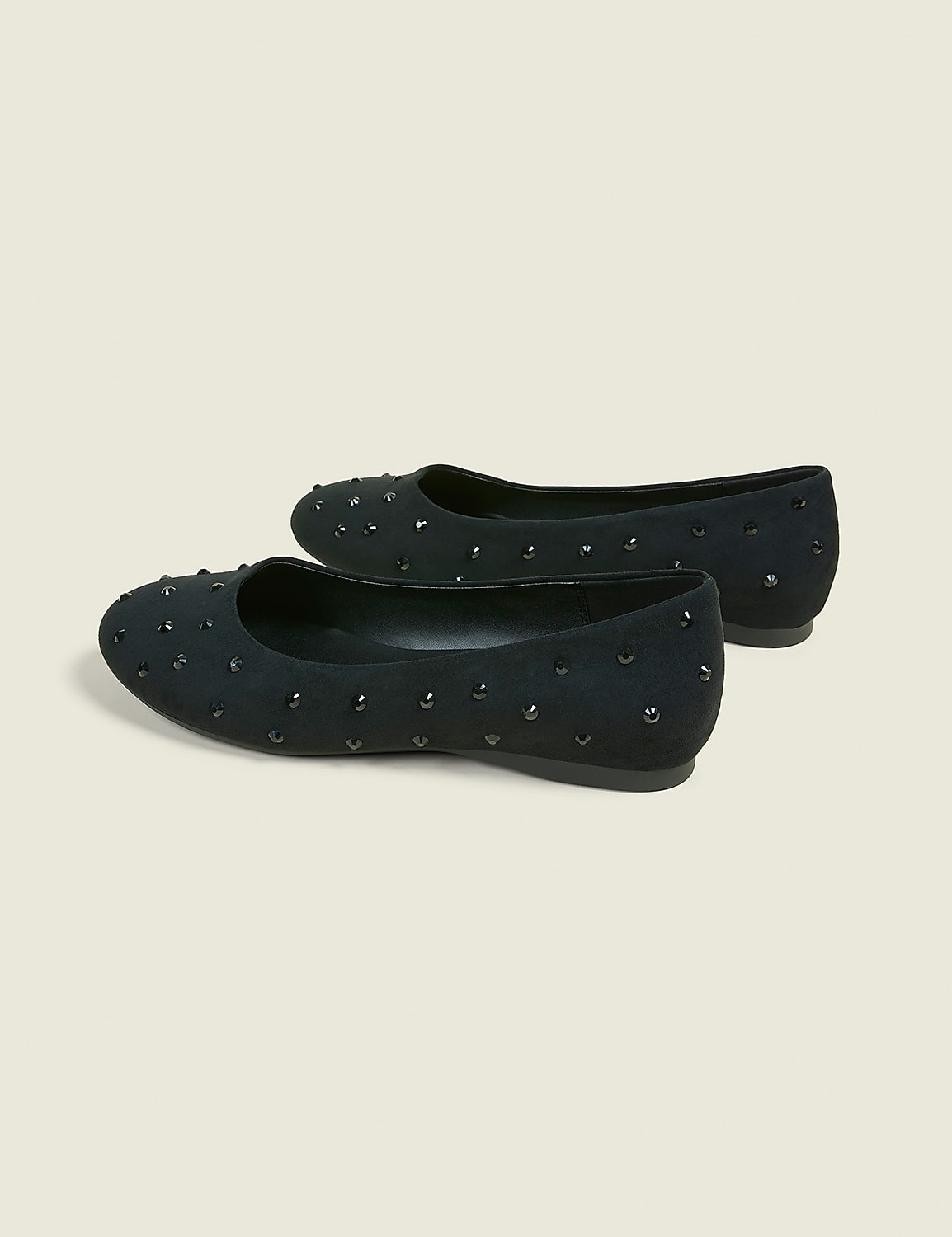 A pair of black studded ballet flats rests on a plain, light-colored background. Product Image 2