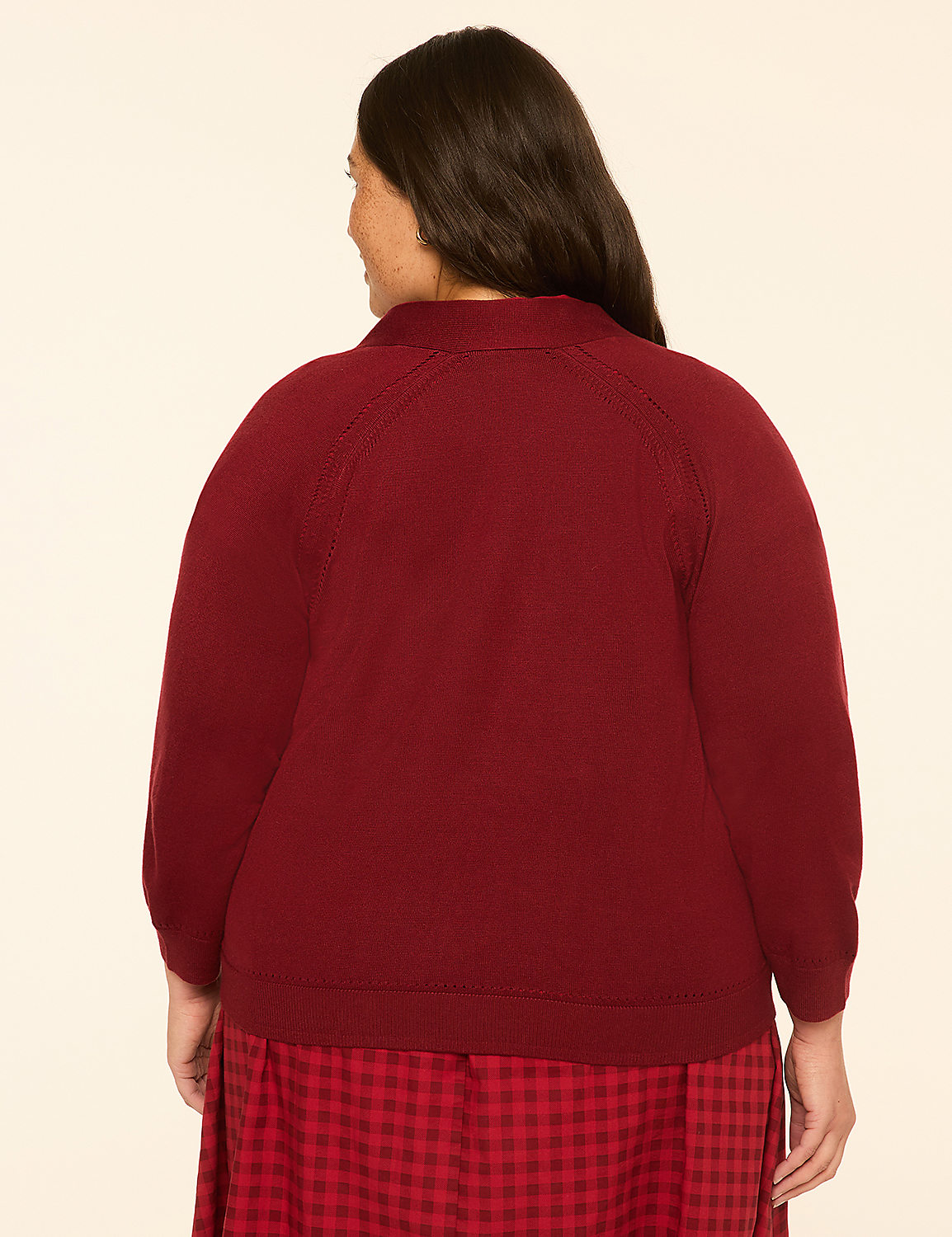 A woman in a maroon sweater and red plaid skirt stands against a plain cream background. Product Image 2