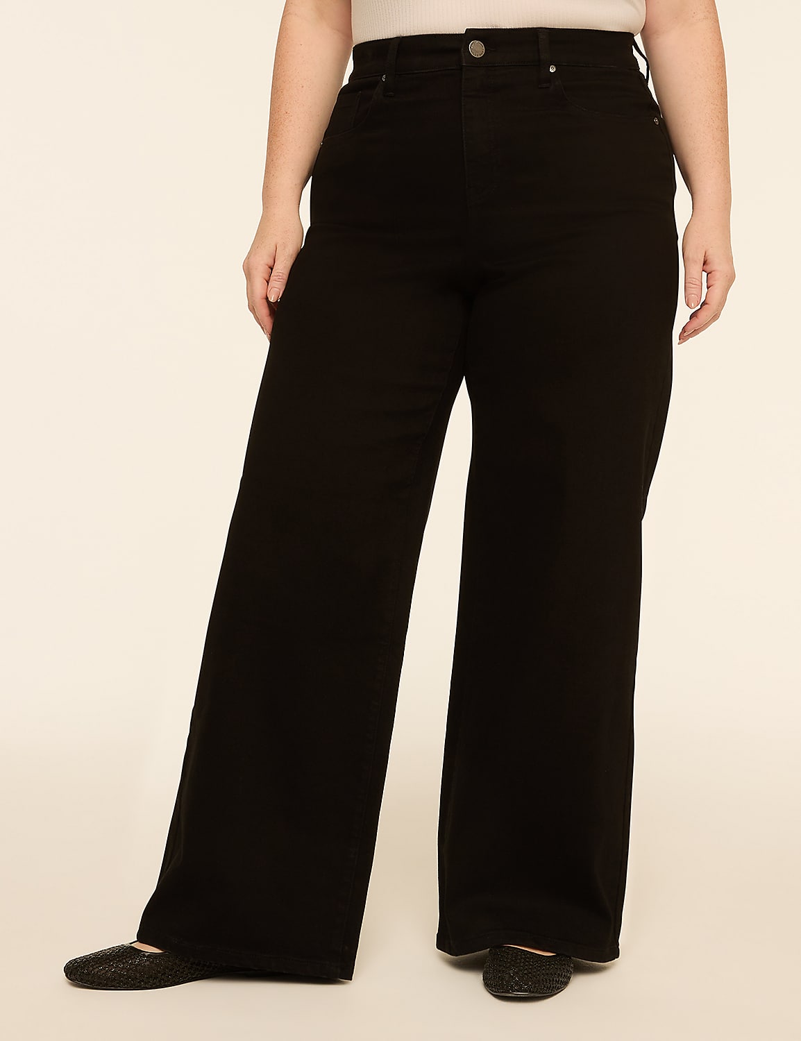 A person wearing black wide-leg jeans and sparkly flats stands against a plain, light-colored background. Product Image 1