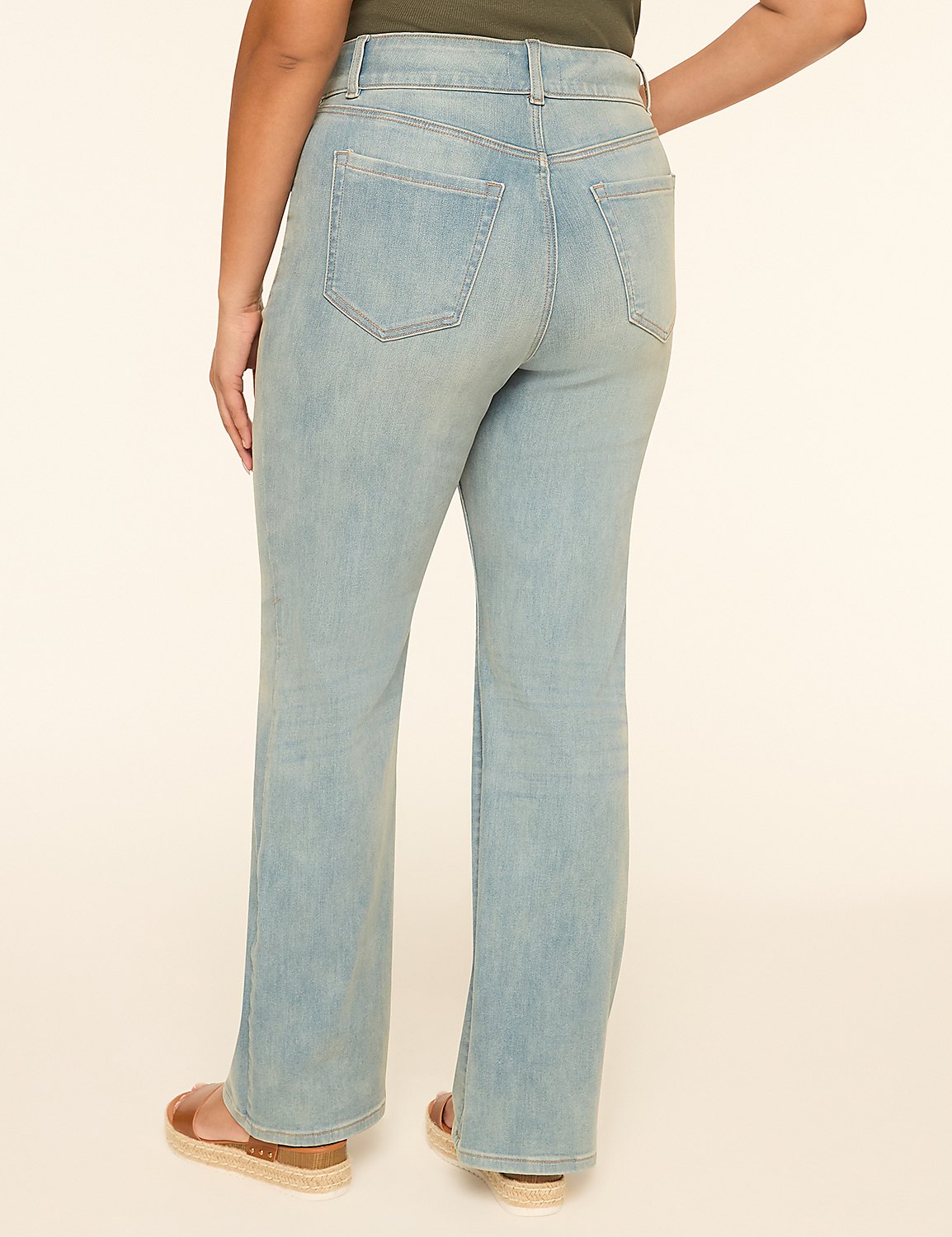 A person wearing light wash bootcut jeans and sandals stands against a plain, light-colored background. Product Image 2