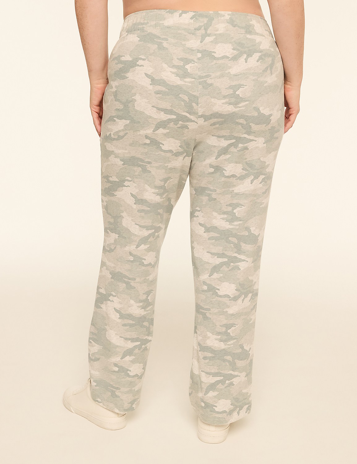 A person wearing camouflage pants stands against a plain, light-colored background. Product Image 2