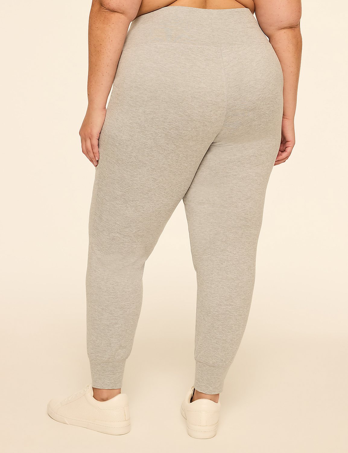 A person wearing grey sweatpants and white sneakers stands against a plain beige background. Product Image 2