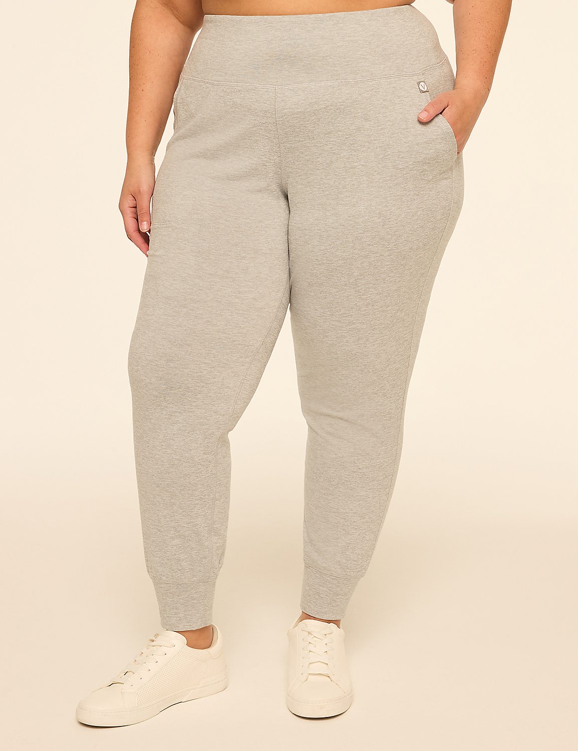 A person wearing grey sweatpants and white sneakers stands against a plain, light-colored background. Product Image 1