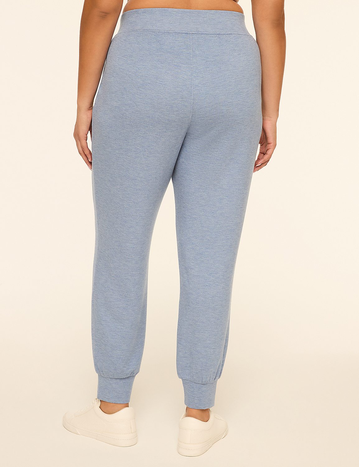 A person wearing light blue sweatpants and white sneakers stands against a plain, light-colored background. Product Image 2