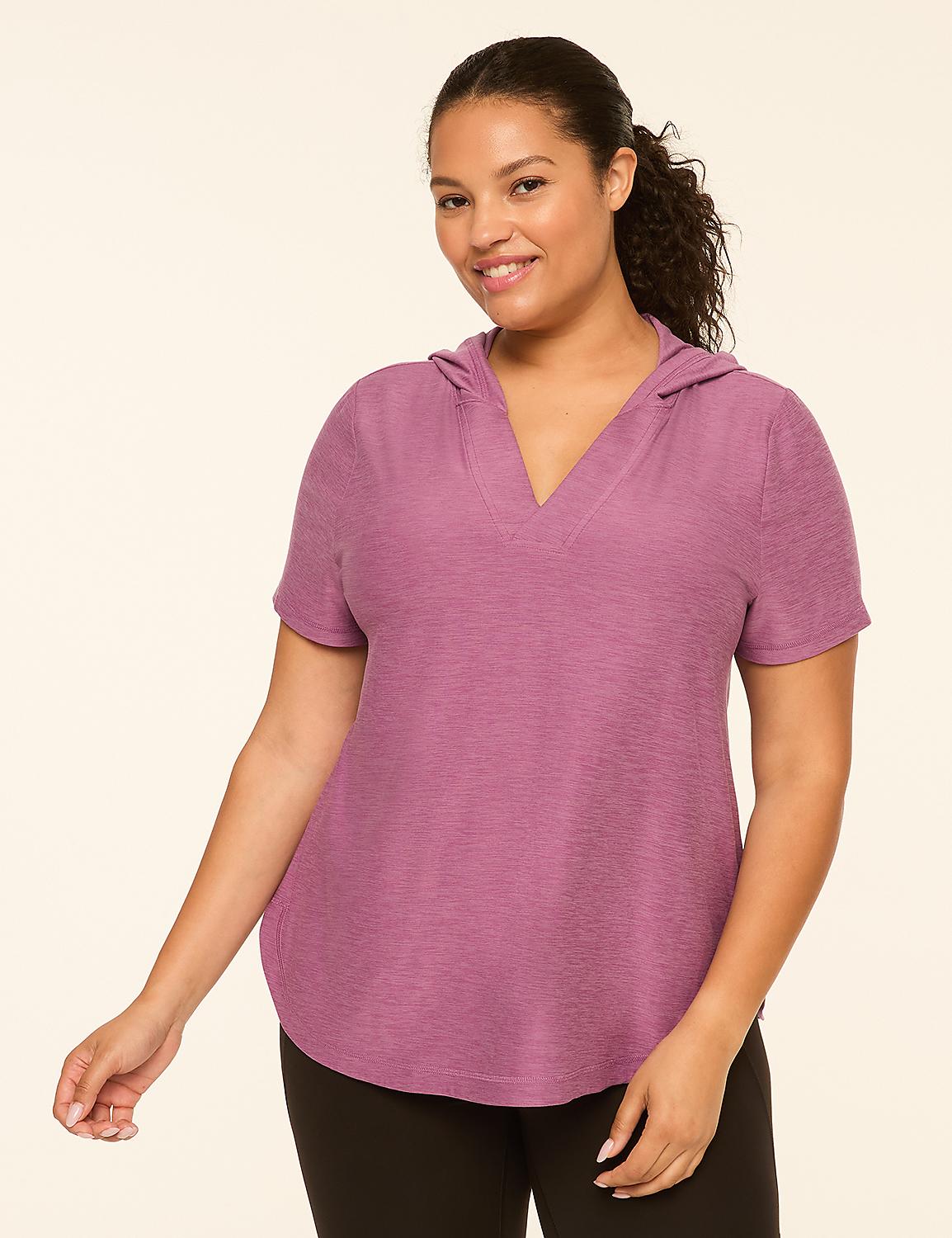 A smiling woman in a purple hooded shirt stands against a plain, light-colored background. Product Image 1