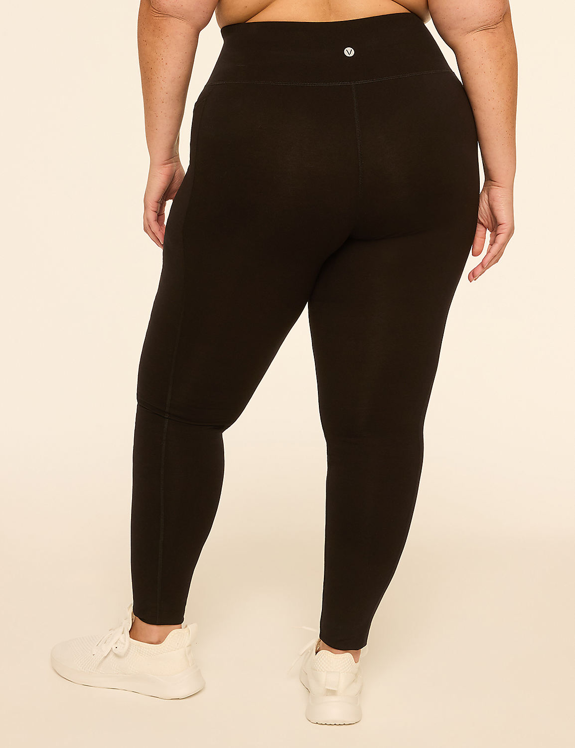 A person wearing black leggings and white sneakers stands against a plain, light-colored background. Product Image 2