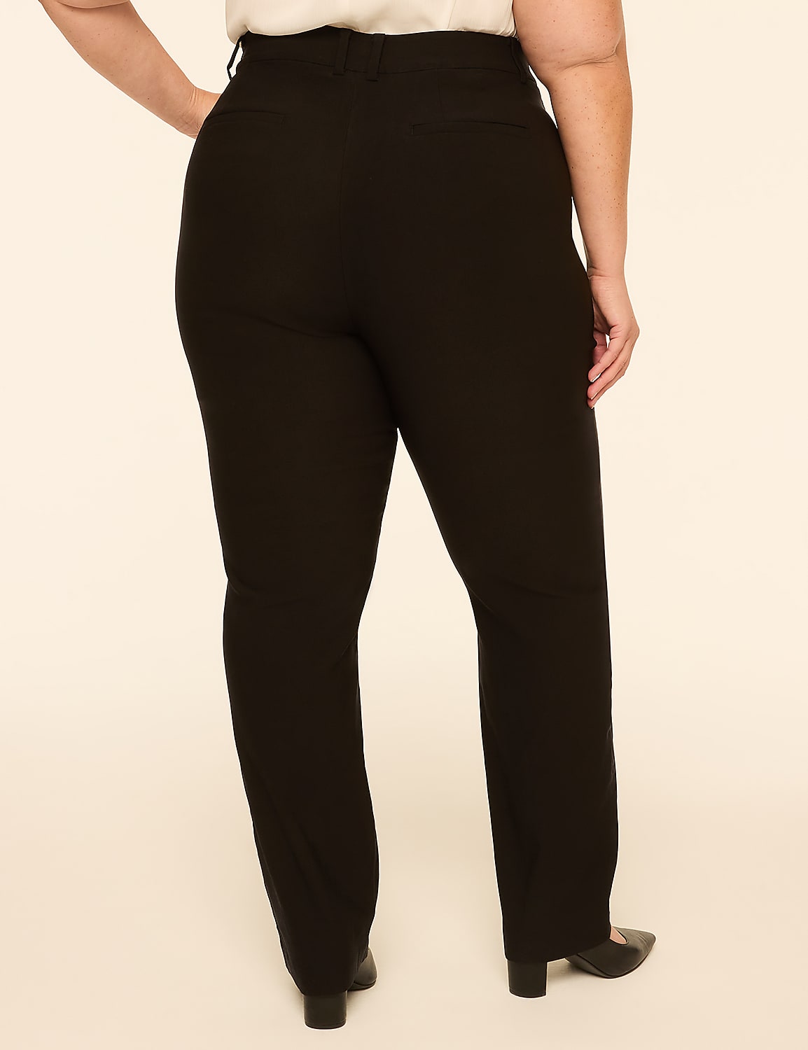 A person wearing black pants stands against a plain, light-colored background. Product Image 2
