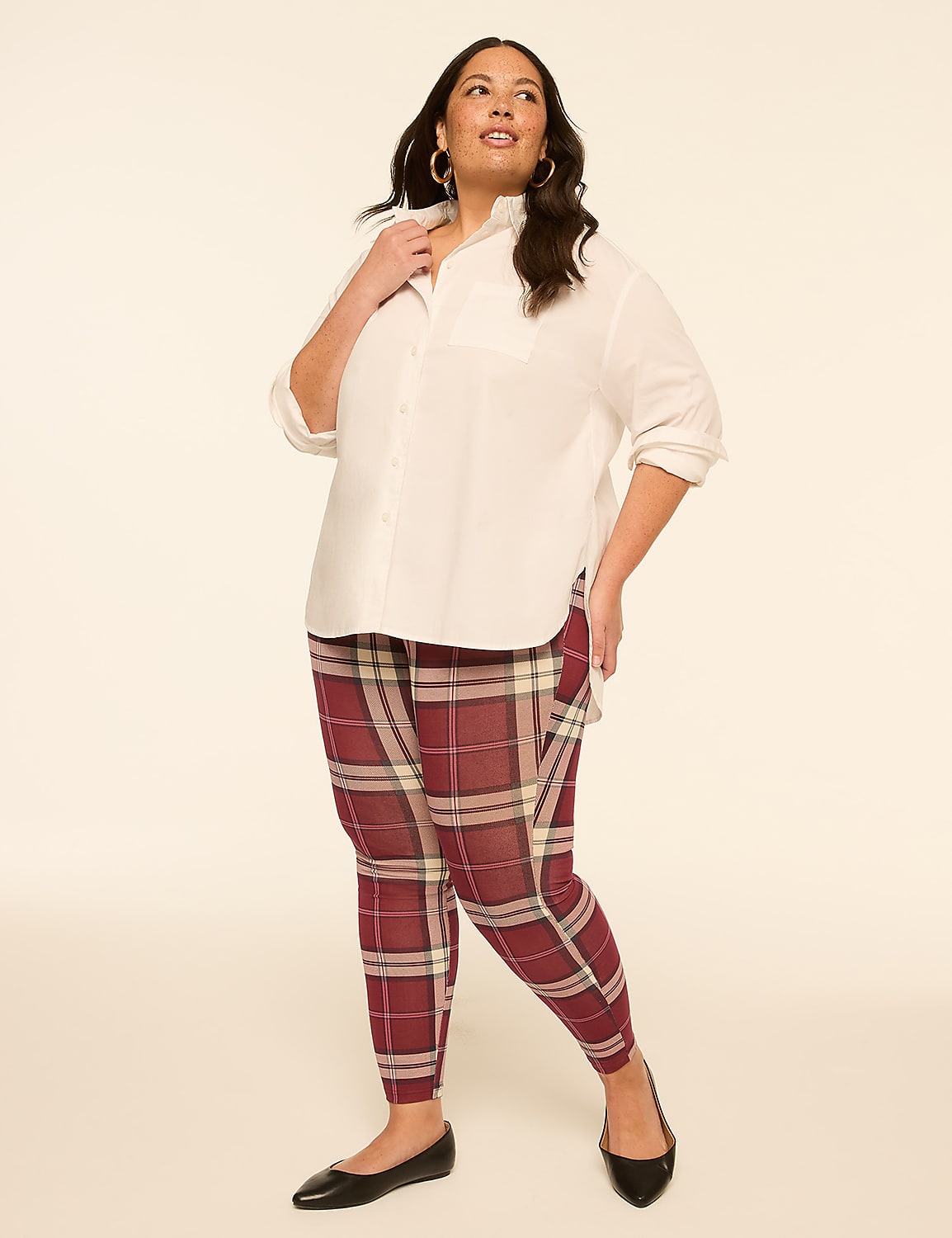 A woman in a white blouse and plaid pants stands against a plain, light-colored background. Product Image 3