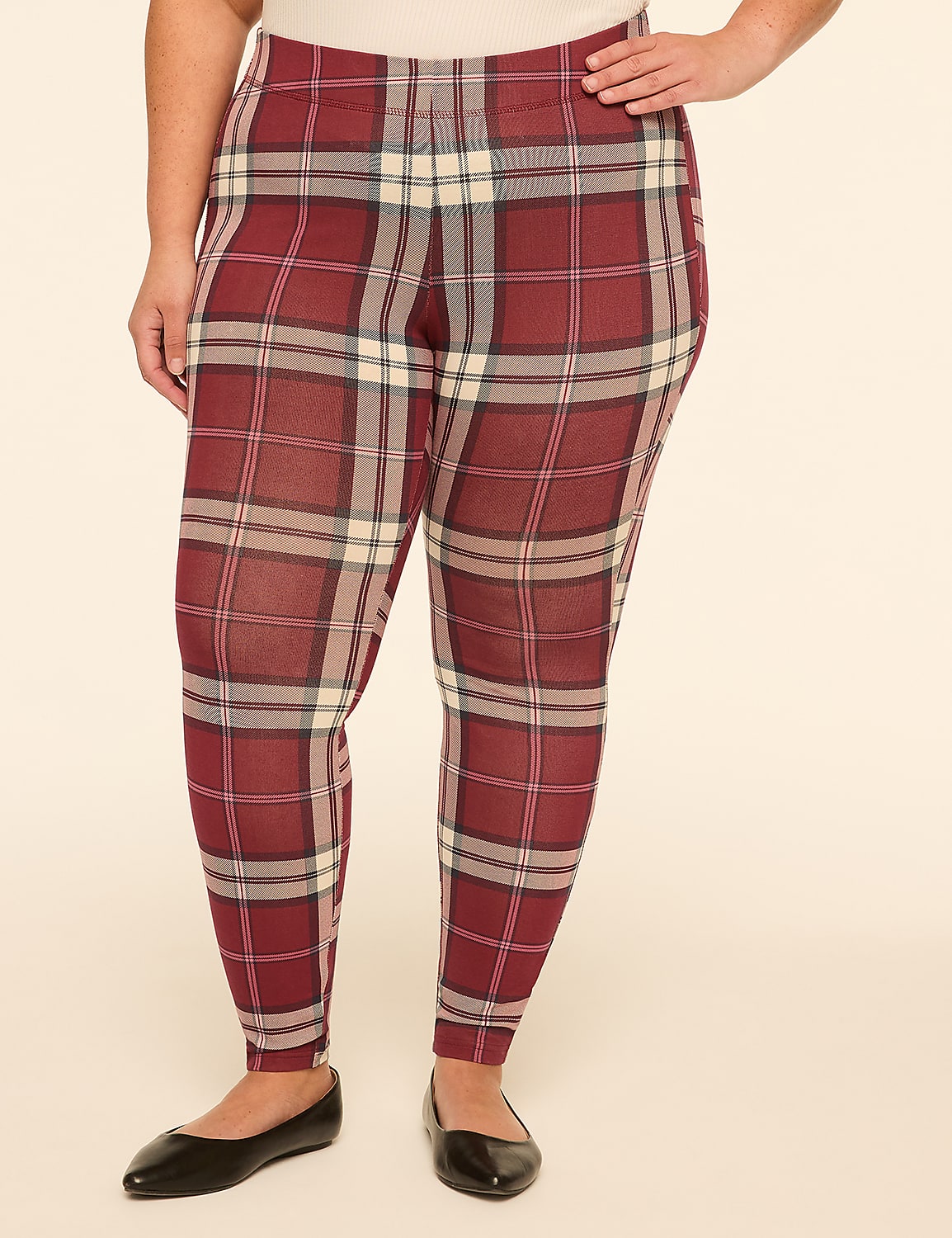 A person wearing red plaid leggings and black ballet flats stands against a plain, light-colored background. Product Image 1