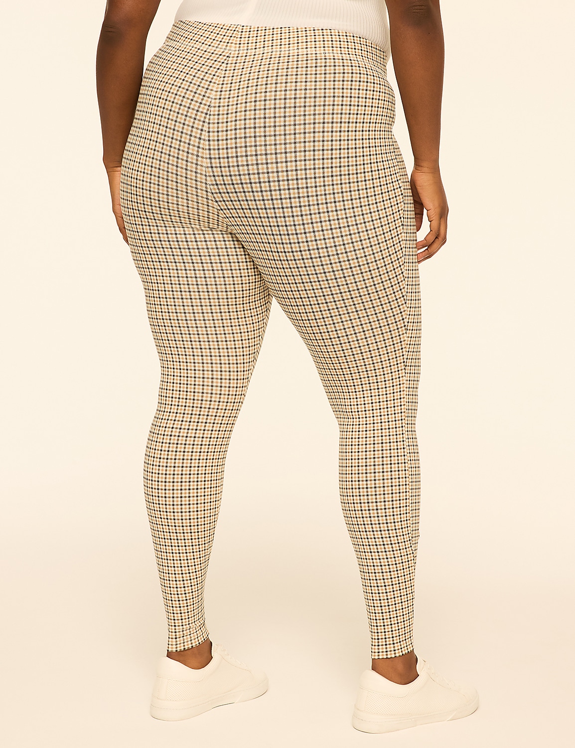 A person wearing plaid leggings and white sneakers stands against a plain, light-colored background. Product Image 2