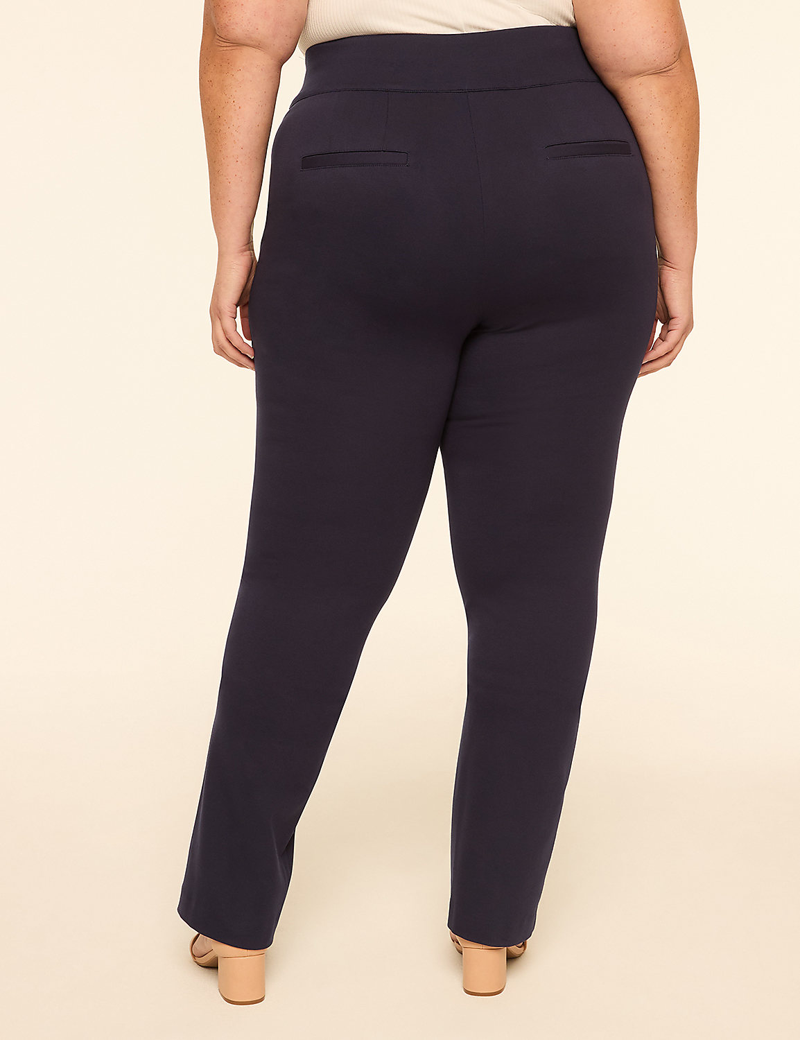 A person wearing navy blue pants stands against a plain, light-colored background. Product Image 2