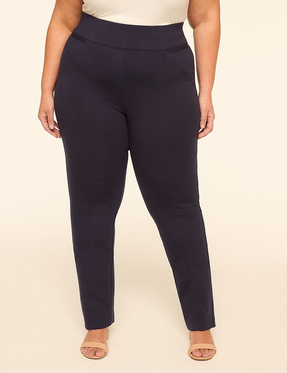 A person stands in dark blue pants and light-colored sandals against a plain, light background. Product Image 1