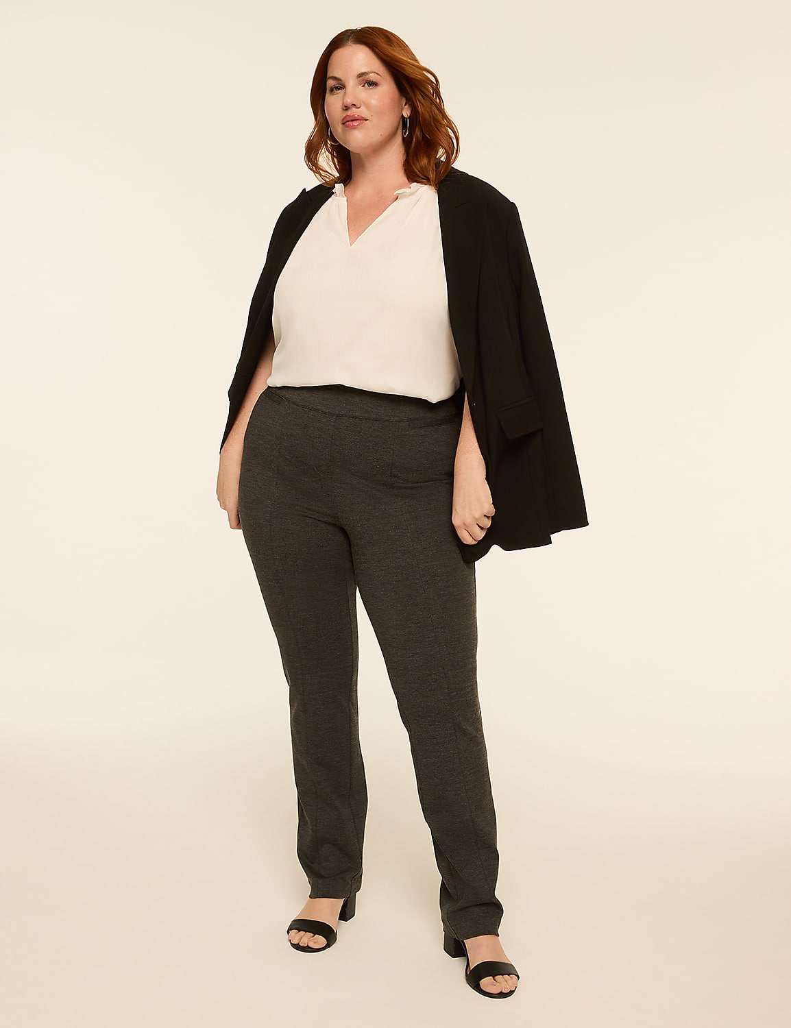 A woman in a white blouse, dark pants, and a black blazer draped over her shoulders stands against a plain, light-colored background. Product Image 3