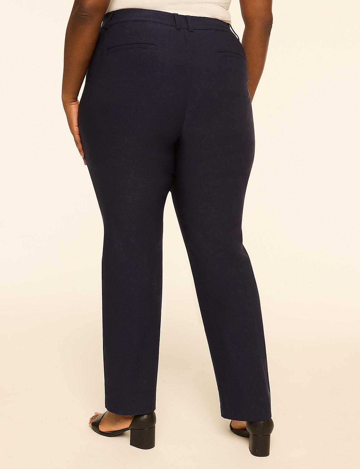 A person wearing navy blue dress pants and black heels stands against a plain, light-colored background. Product Image 2