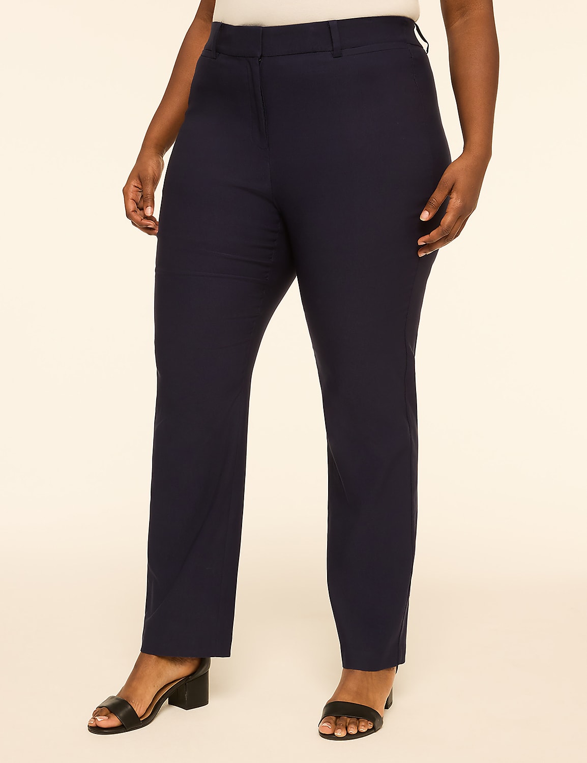 A person wearing navy blue dress pants and black sandals stands against a plain, light-colored background. Product Image 1