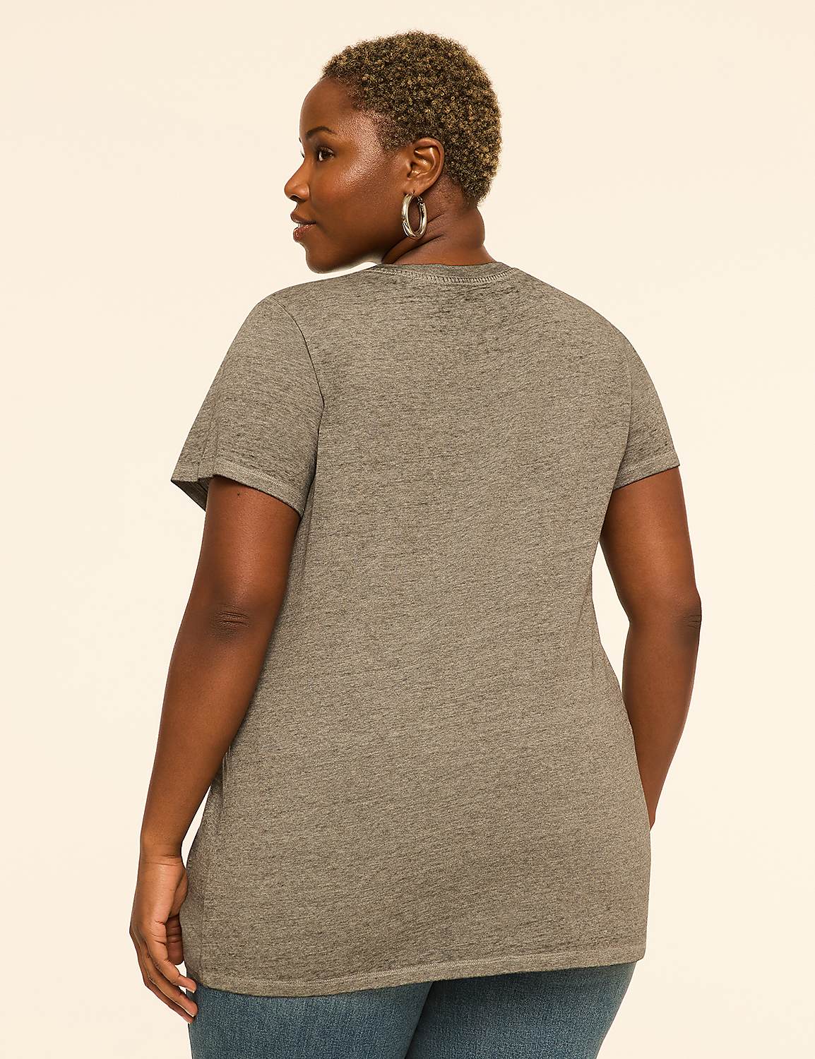 A woman in a grey t-shirt and blue jeans stands against a plain, light-colored background. Product Image 2