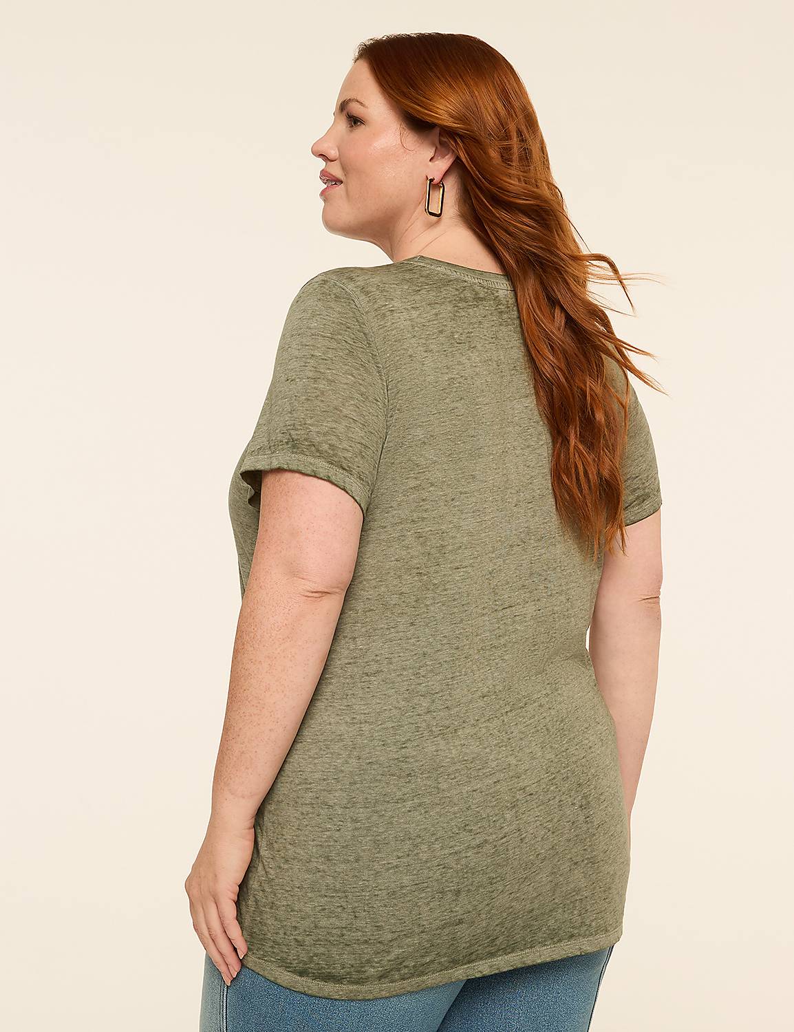 A woman with red hair stands in the foreground against a plain, light-colored background. Product Image 2