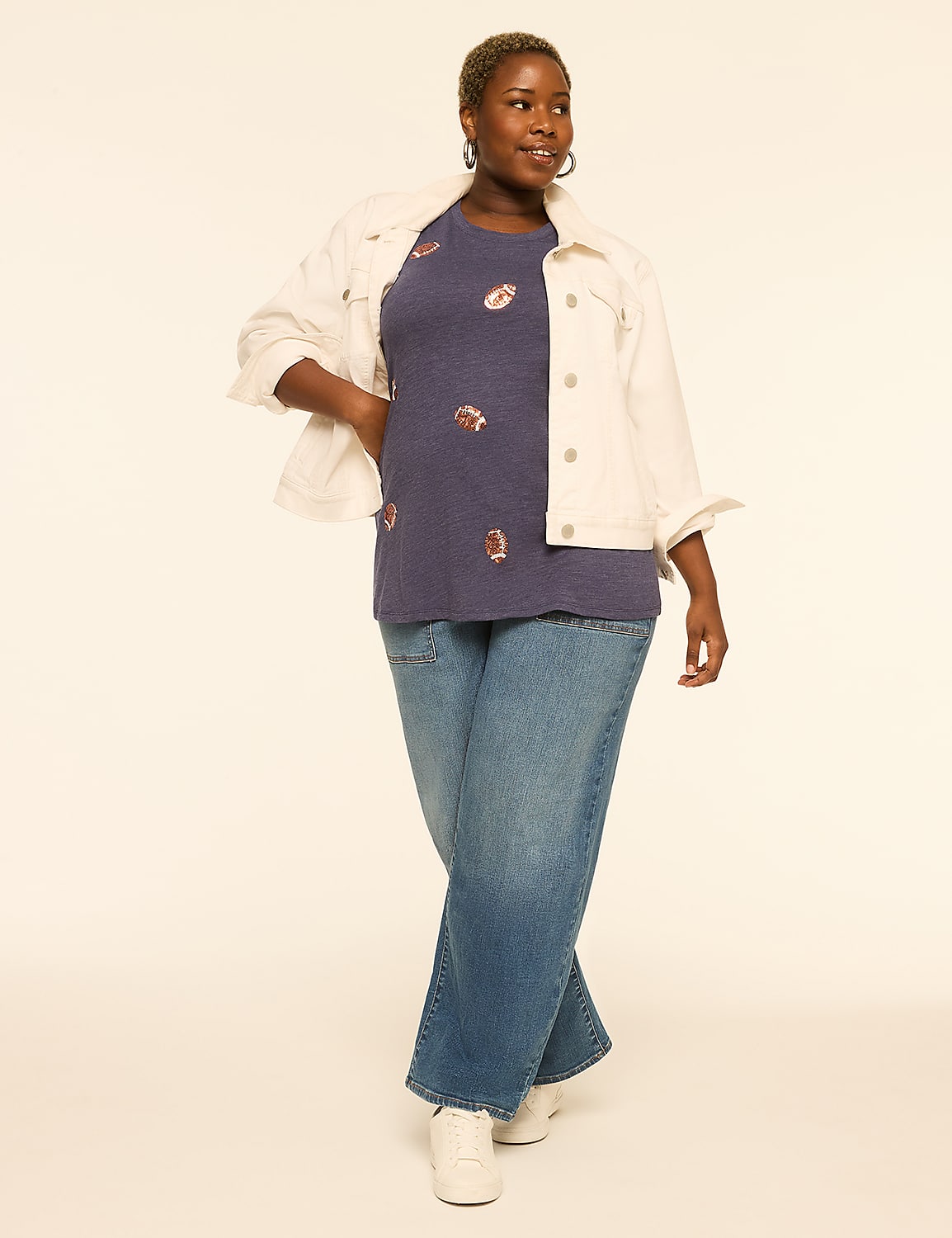 A woman in a denim jacket and jeans stands against a plain, light-colored background. Product Image 3