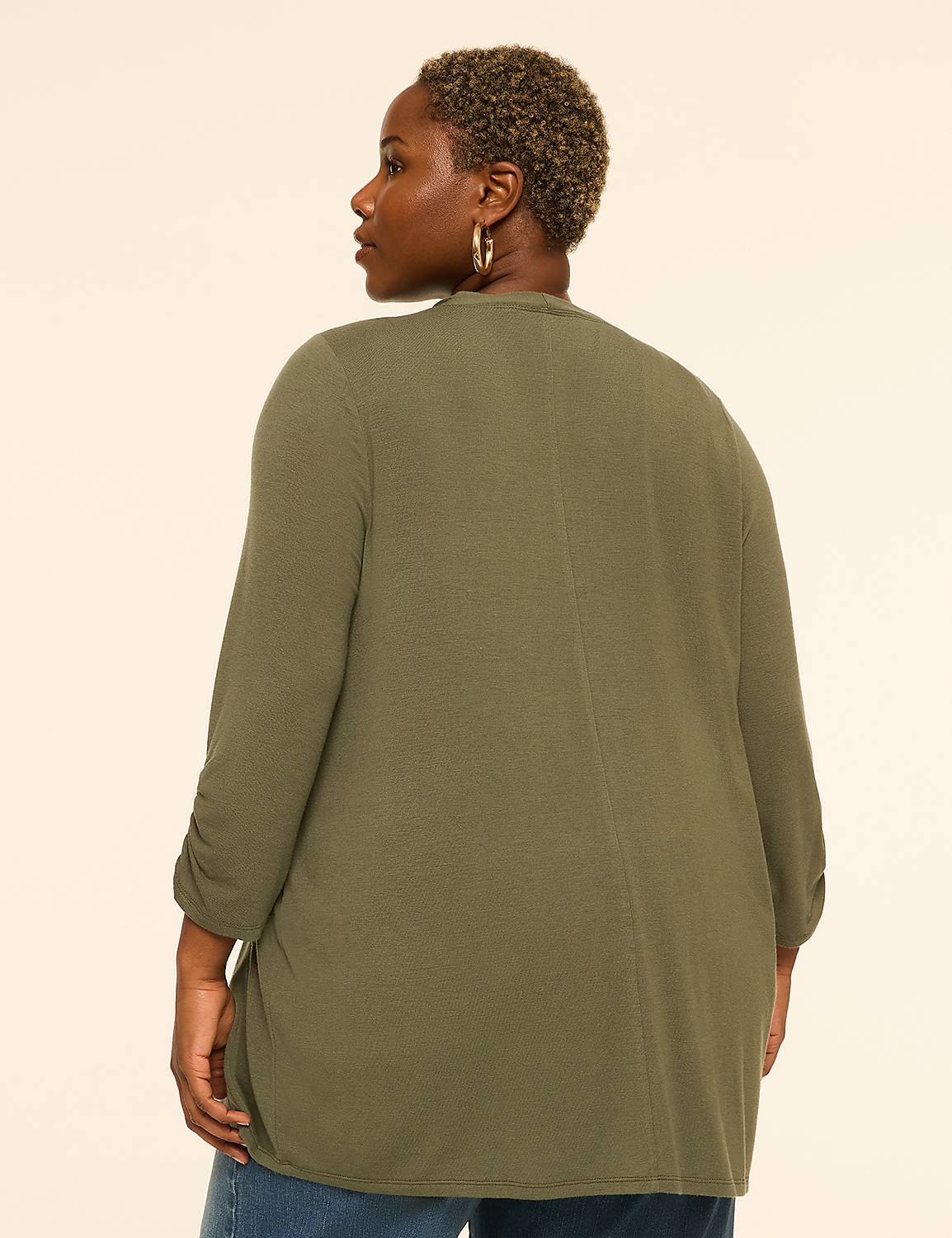 A woman in a green cardigan stands against a plain, light-colored background. Product Image 2