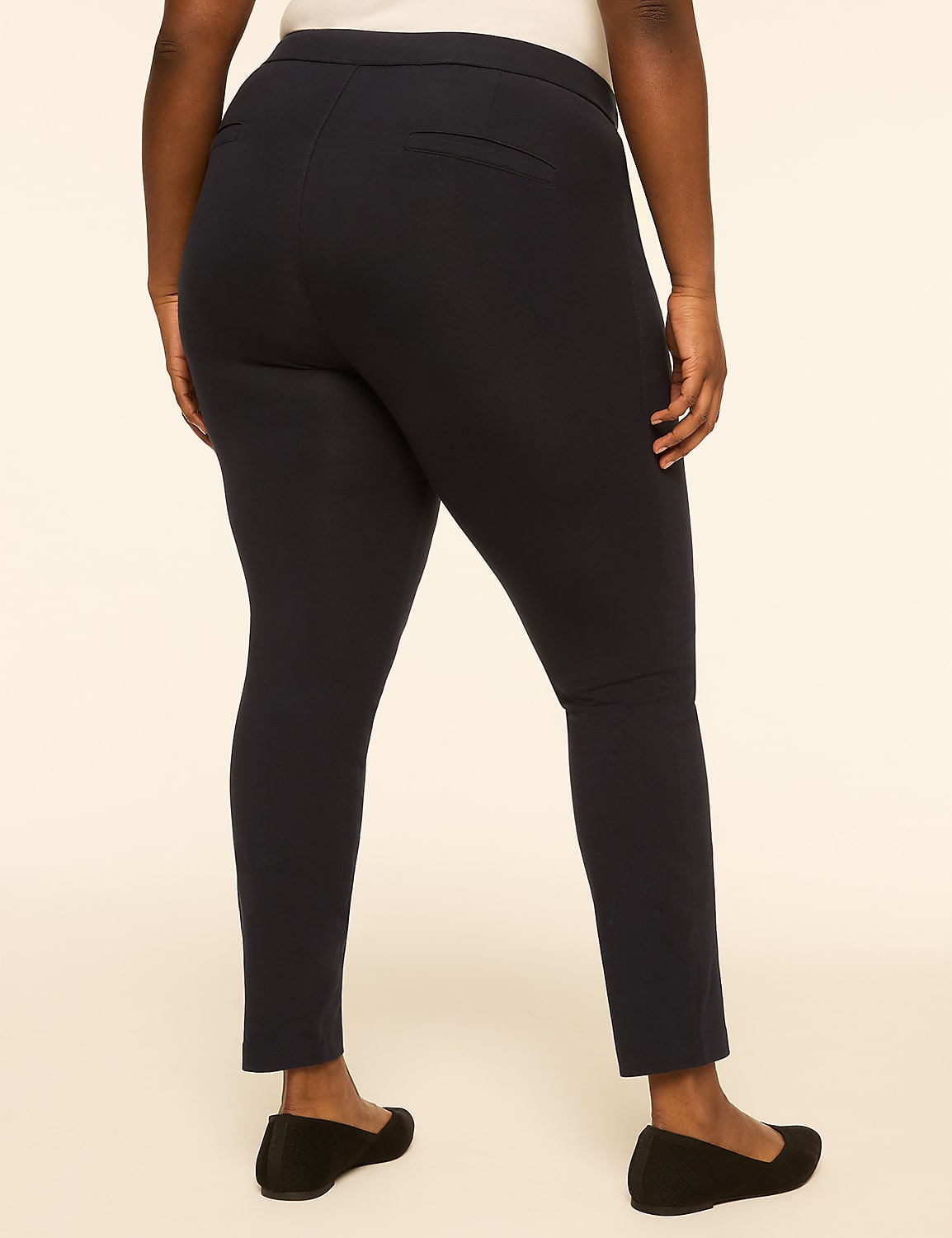 A person wearing dark blue pants and black flats stands against a plain, light-colored background. Product Image 2