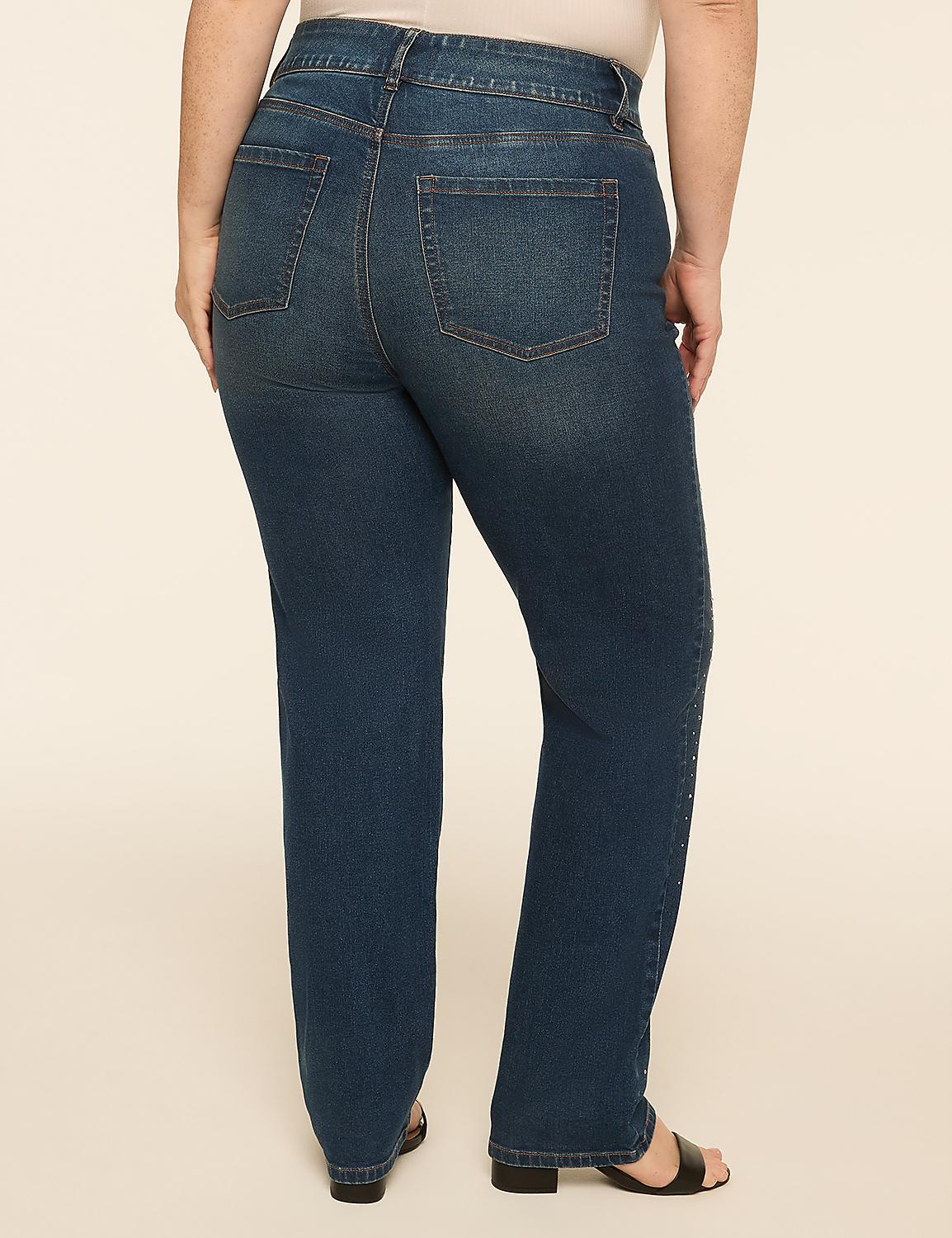 A person wearing dark wash denim jeans stands against a plain, light-colored background. Product Image 2