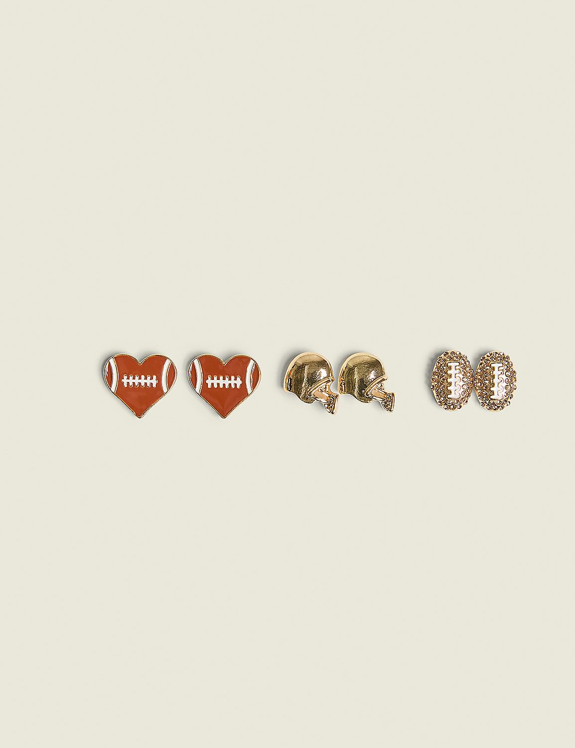 Two pairs of football-themed earrings, heart-shaped and helmet-shaped, are arranged on a plain, light-colored background. Product Image 1