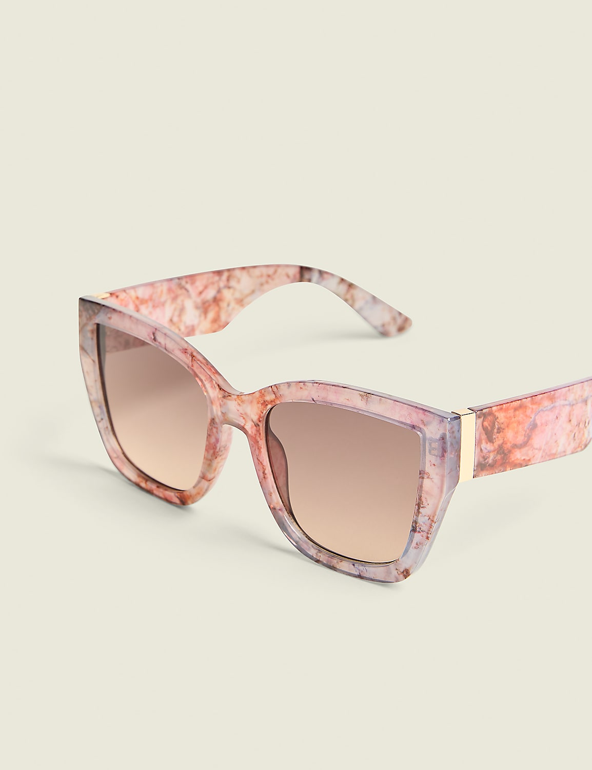 A pair of marbled pink and purple sunglasses rests on a pale, textured background. Product Image 1