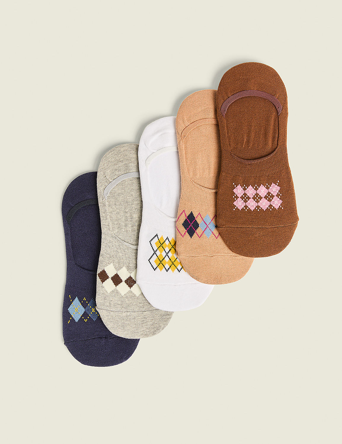 Five no-show socks with argyle patterns are arranged diagonally on a plain, light-colored background. Product Image 1