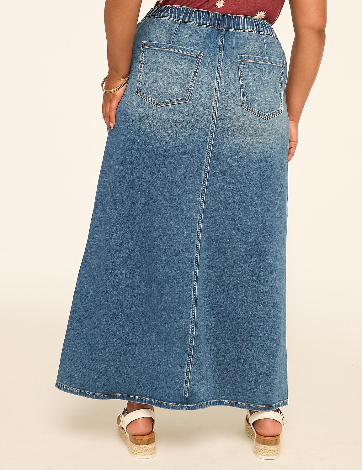 A person wearing a long denim skirt stands against a plain, light-colored background. Product Image 2