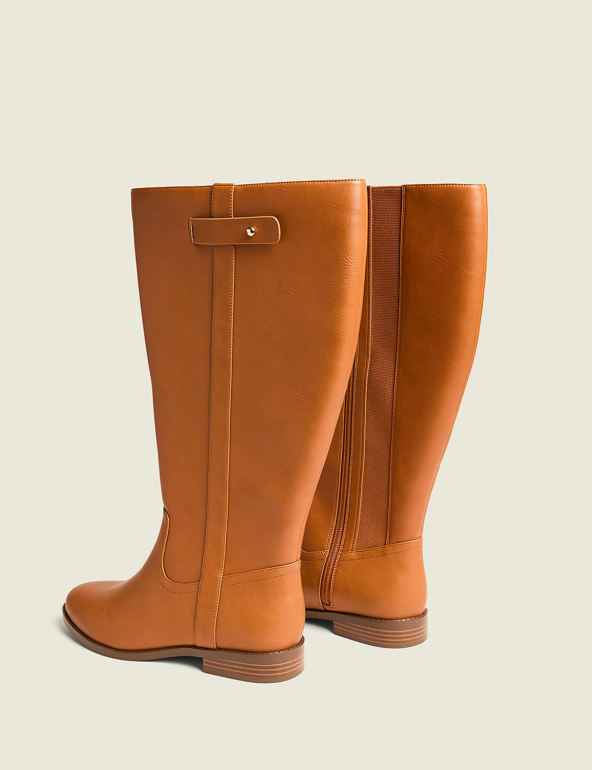 Two tan leather riding boots stand on a light gray background, with the left boot in the foreground and the right boot slightly behind it. Product Image 2