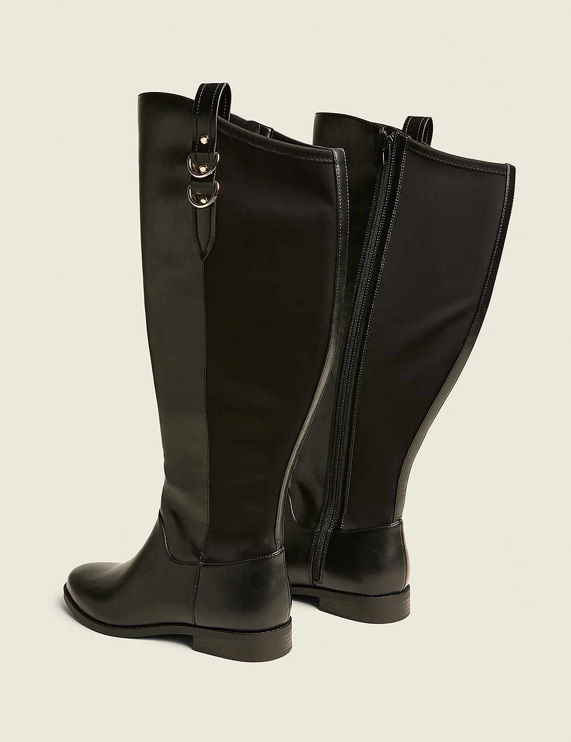 Two black leather knee-high boots with gold ring accents are displayed against a plain, light beige background. Product Image 2