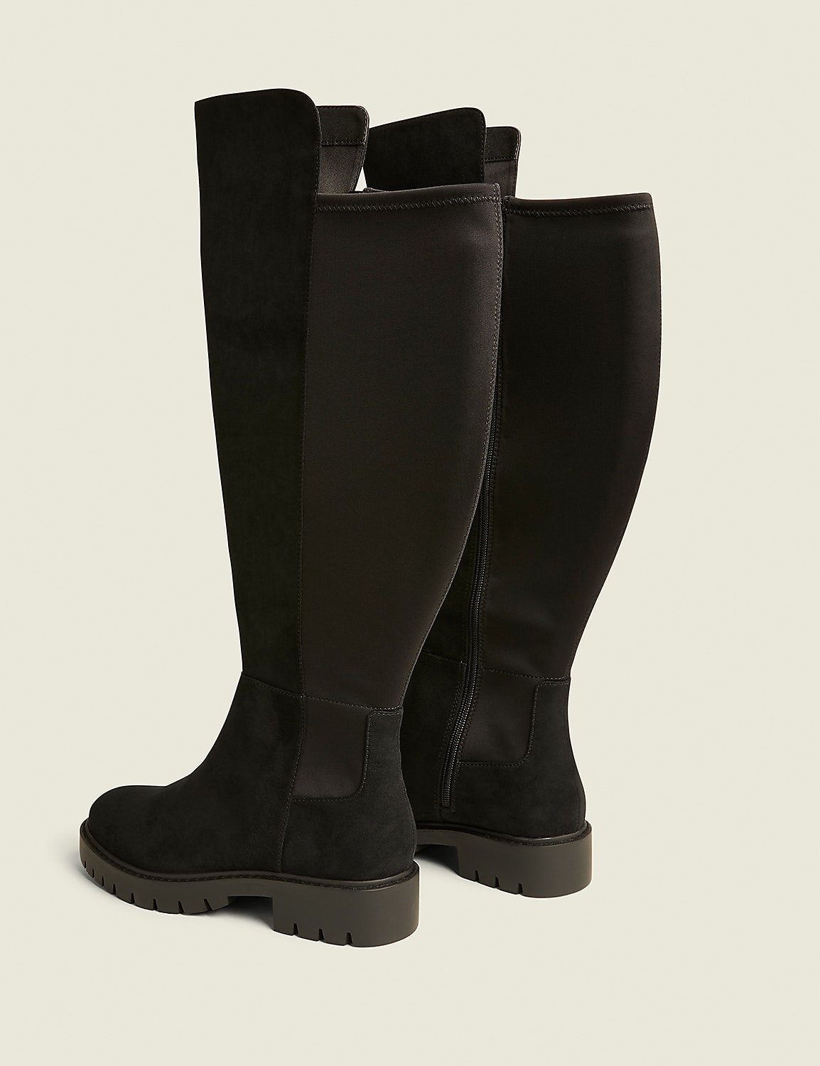 Two black knee-high boots with a suede and fabric upper and a thick sole stand against a plain, light-colored background. Product Image 2