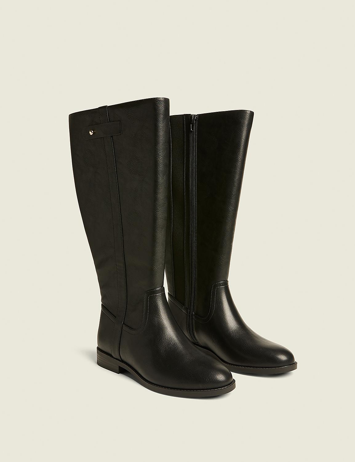 A pair of black leather knee-high boots with a side zipper and a small buckle detail are displayed against a plain, light beige background. Product Image 1