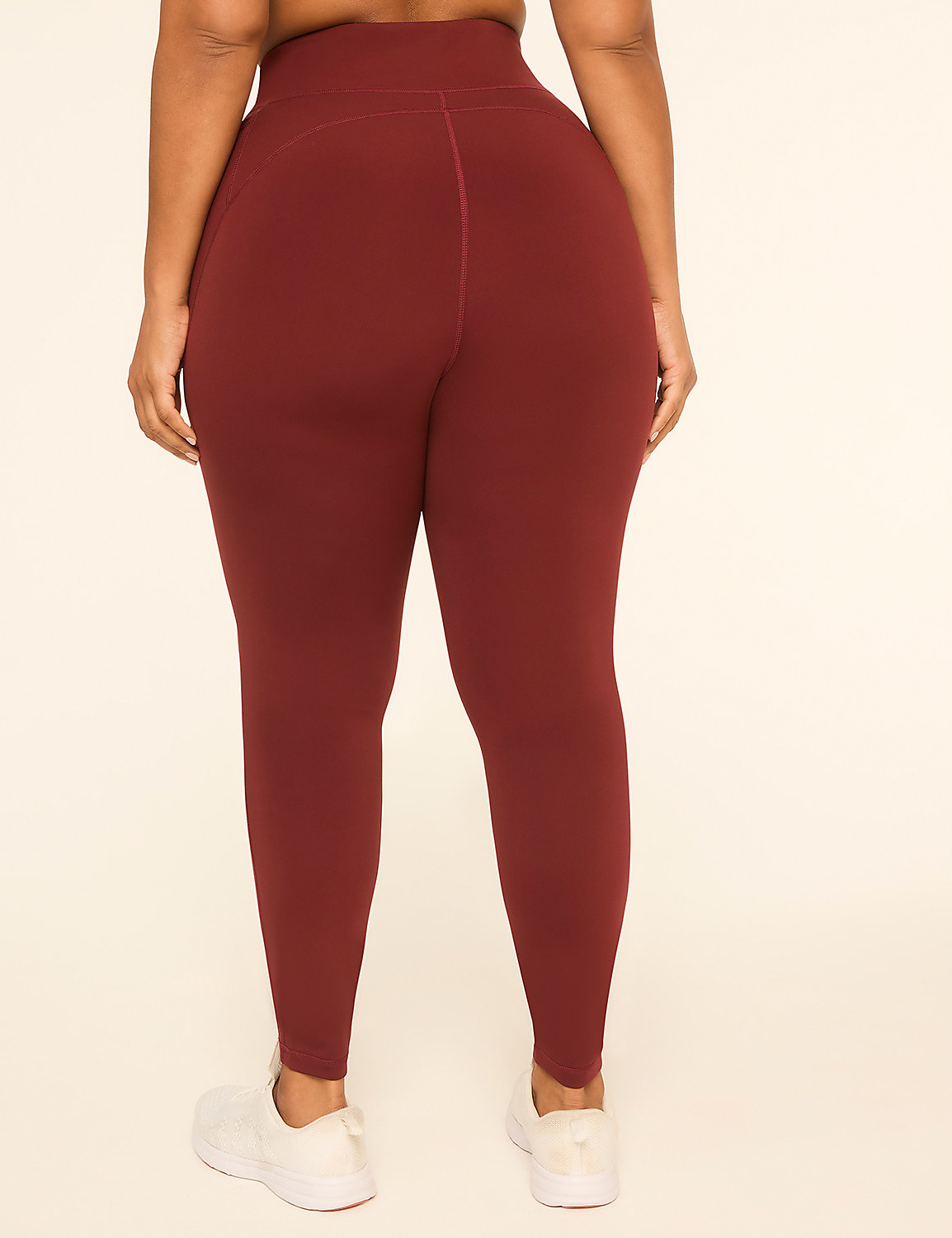 A person wearing maroon leggings and white sneakers stands against a plain, light-colored background. Product Image 2