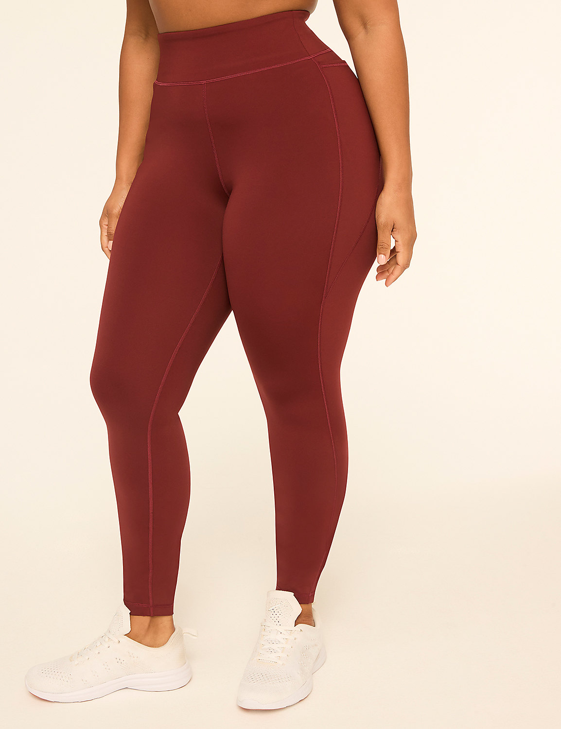 A person wearing maroon leggings and white sneakers stands against a plain, light-colored background. Product Image 1