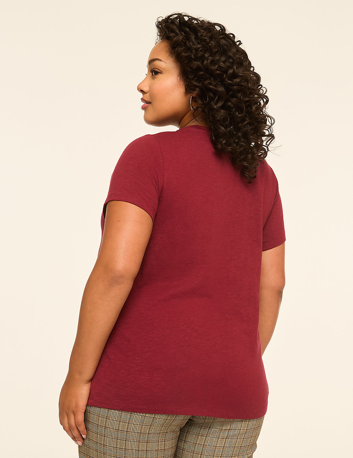 A woman in a maroon t-shirt and plaid pants stands against a plain, light-colored background. Product Image 2