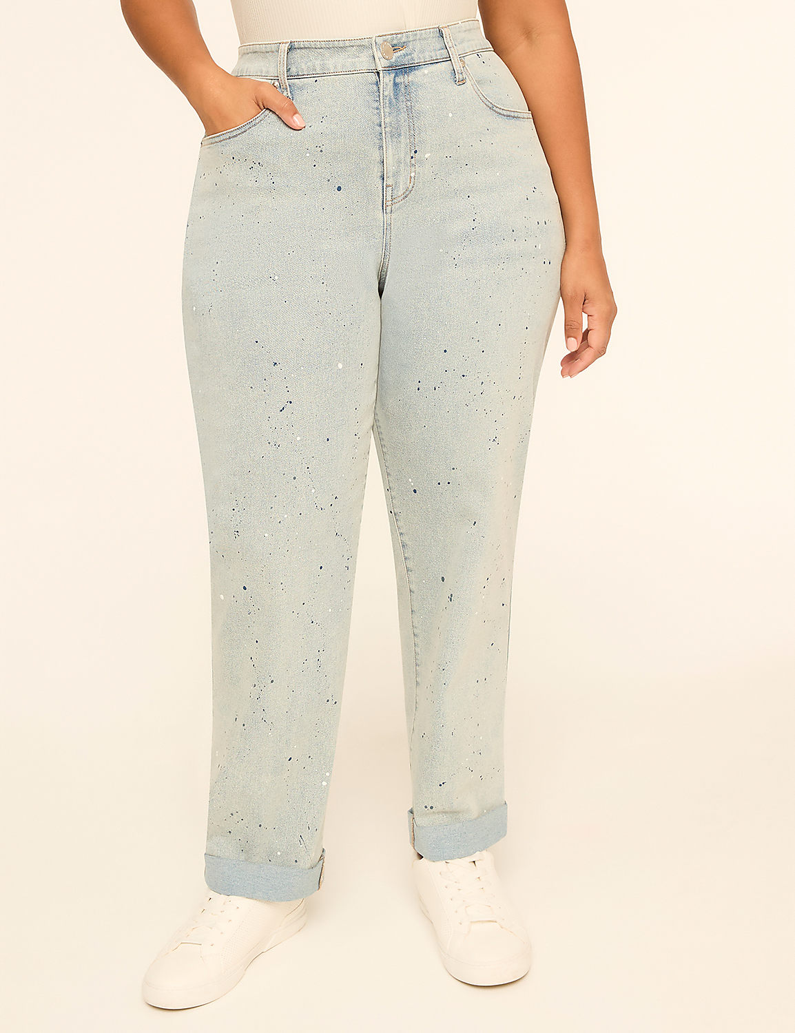A person stands in light-wash, rhinestone-embellished jeans with cuffed ankles and white sneakers against a plain, light-colored background. Product Image 1