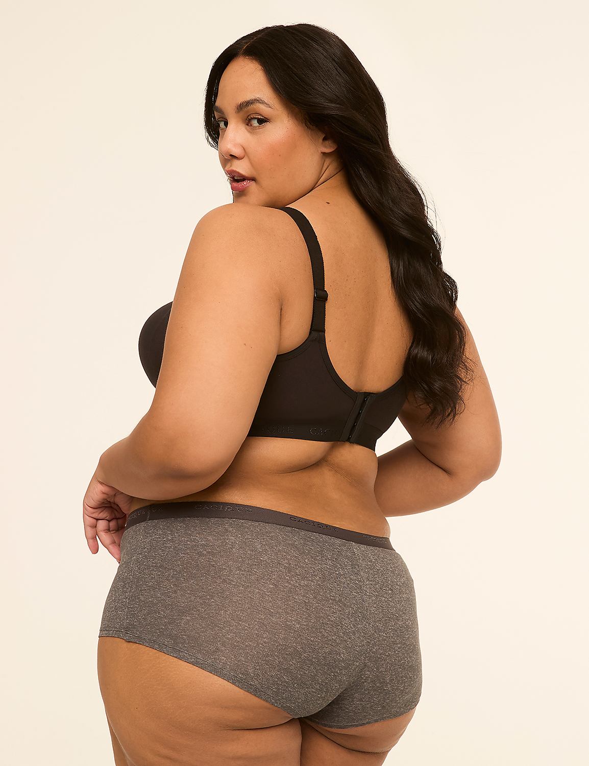 A woman in a black bra and grey underwear poses against a plain, light-colored background. Product Image 2