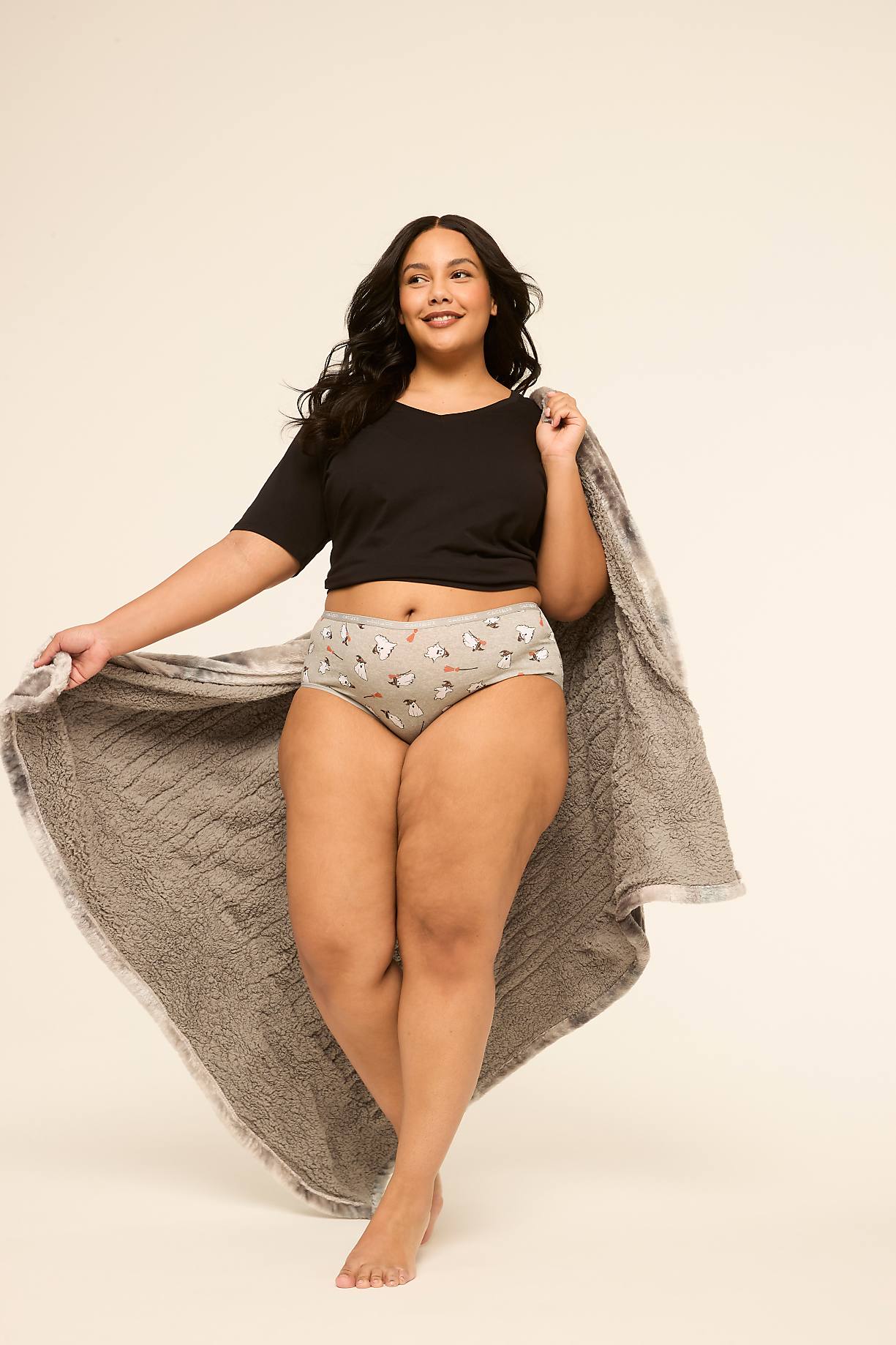 A woman in a black crop top and patterned underwear holds a fuzzy gray blanket, standing against a plain, light-colored background. Product Image 5