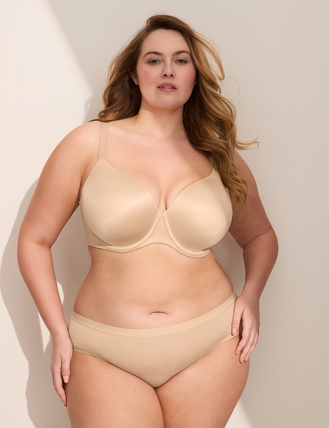 A woman in beige lingerie stands against a softly lit, neutral background. Product Image 4