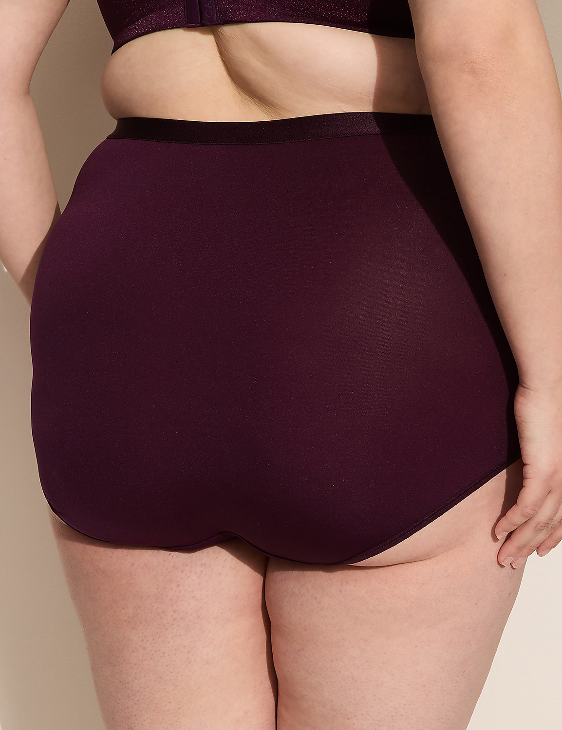 A person's back is shown from the waist down, wearing plum-colored high-waisted underwear and a matching bra, against a plain, light-colored background. Product Image 2