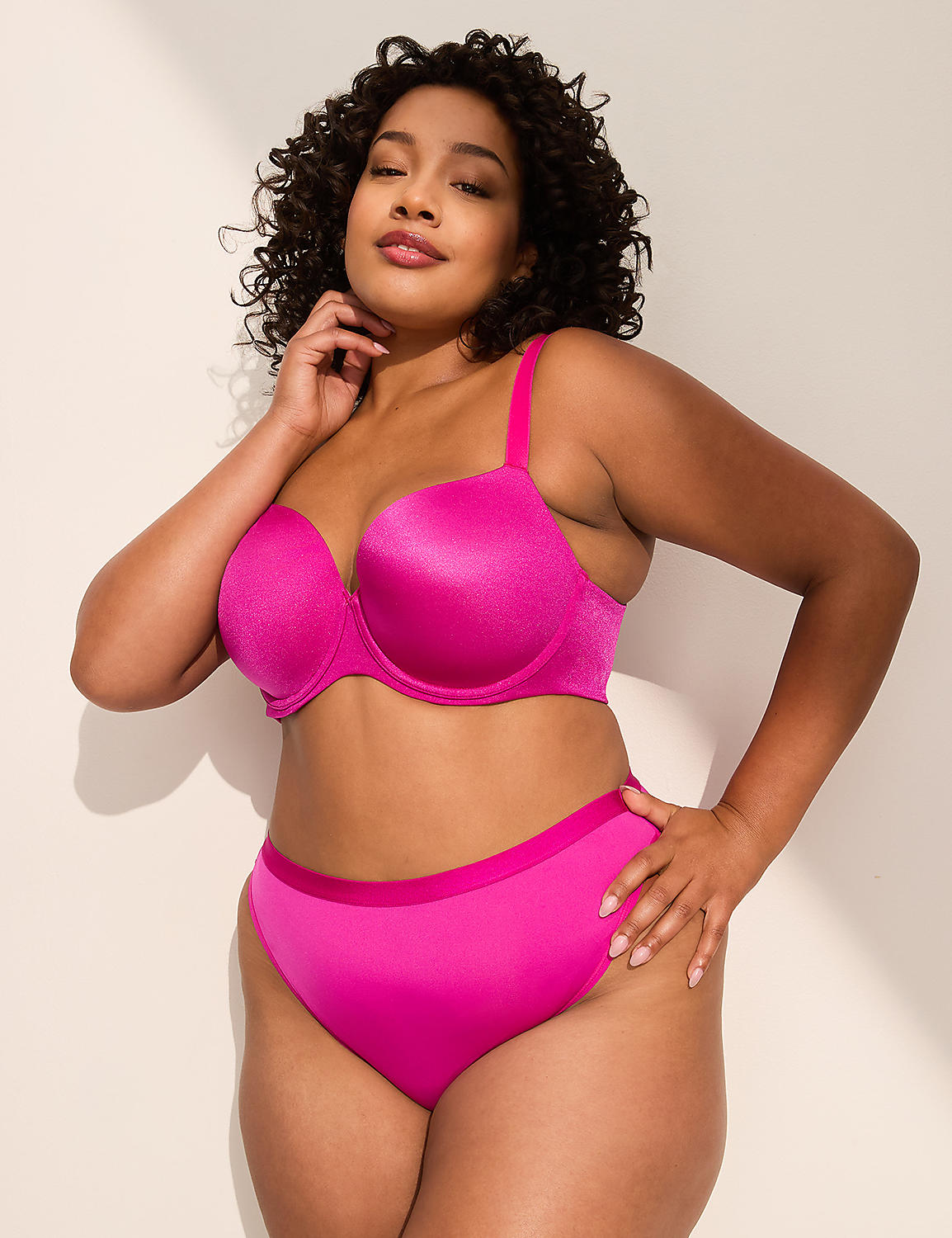A woman in a bright pink bra and matching underwear poses against a plain, light-colored wall. Product Image 3