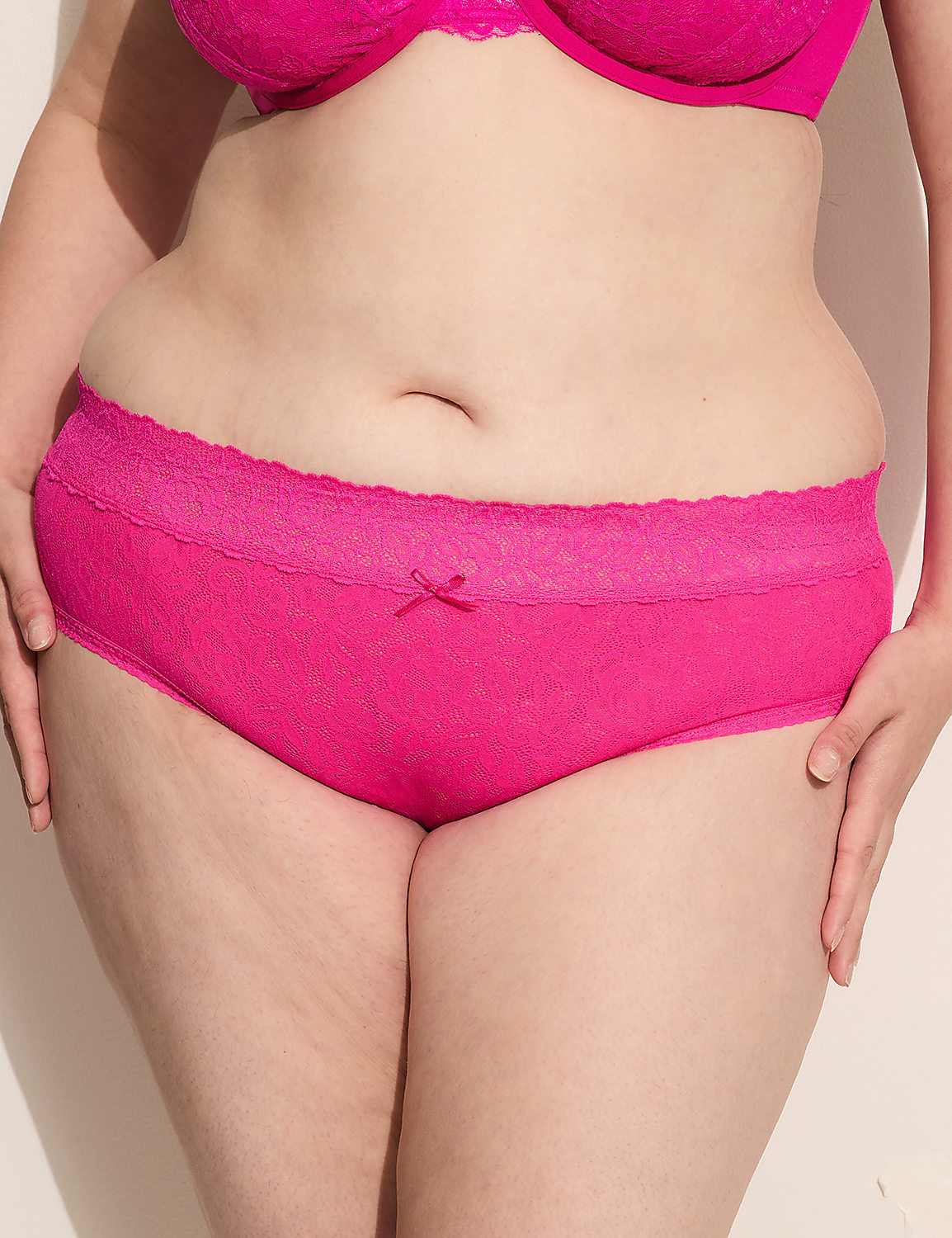 A person in bright pink lingerie stands against a plain white background. Product Image 1